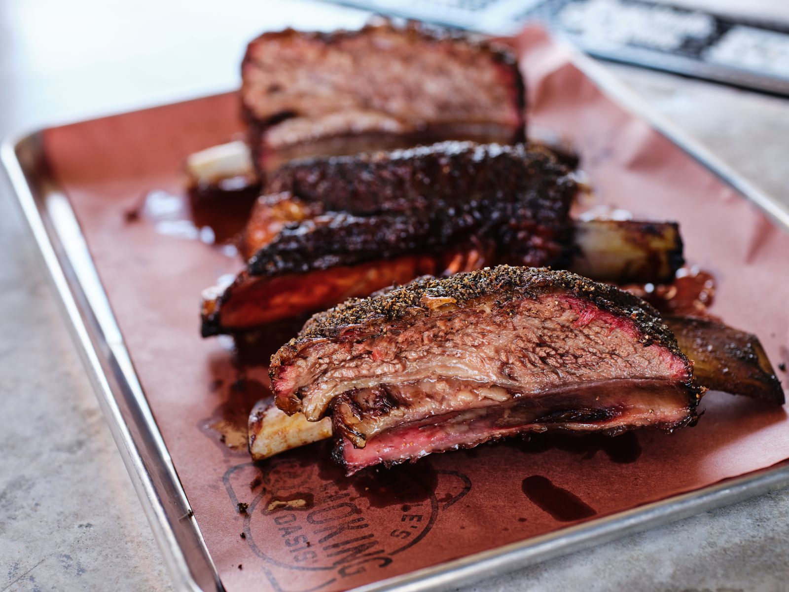 Close-up of smoked brisket with a deep bark