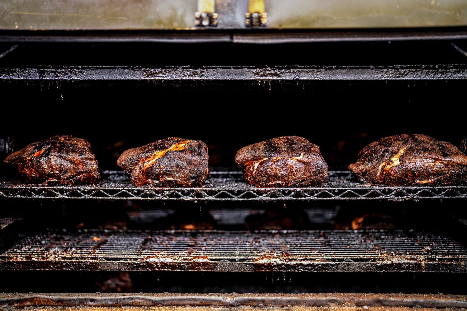 Smoked pork butts on the pit at Bringle's Smoking Oasis